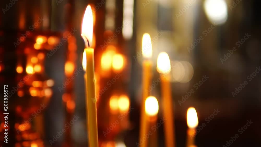 One burning candle in focus, the Orthodox Church One burning candle in focus, the Orthodox Church
