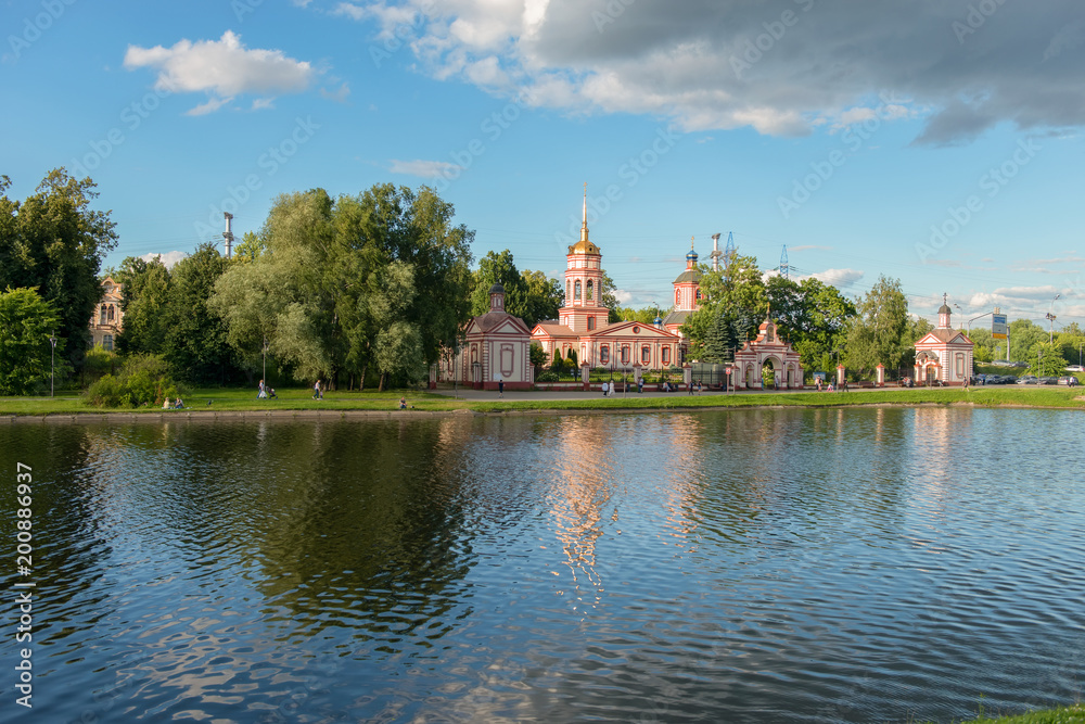 MOSCOW, RUSSIA - 23 JULY, 2017: Altufyevo Manor and Church of the Exaltation of the Holy Cross. Altufevsky Pond in a recreation area in Altufevo, Moscow MOSCOW, RUSSIA - 23 JULY, 2017: Altufyevo Manor and Church of the Exaltation of the Holy Cross. Altufevsky Pond in a recreation area in Altufevo, Moscow