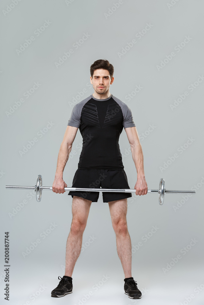 Full length portrait of a concentrated young sportsman Full length portrait of a concentrated young sportsman