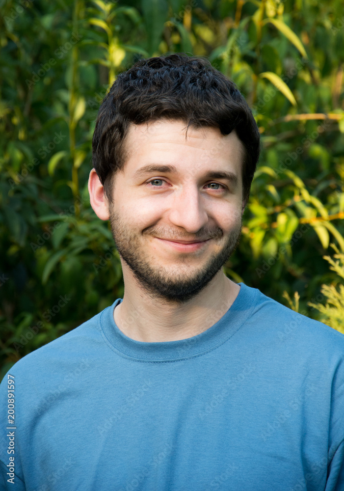 Young, handsome man outdoors smiling. Young, handsome man outdoors smiling.