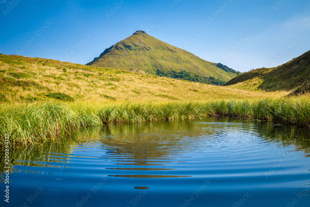 Lake and peak summer landscape