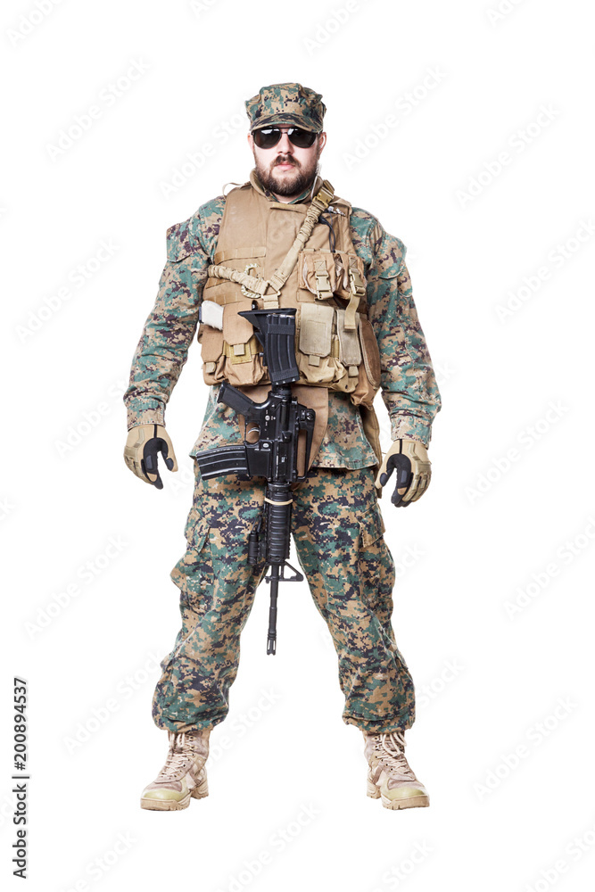 Studio shot of United States Marine with rifle weapons in uniforms. Military equipment, army helmet, combat boots, tactical gloves. Isolated on white, weapons, army, patriotism concept Studio shot of United States Marine with rifle weapons in uniforms. Military equipment, army helmet, combat boots, tactical gloves. Isolated on white, weapons, army, patriotism concept
