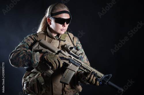 Φωτογραφία Studio shot of United States Marine with rifle weapons in uniforms