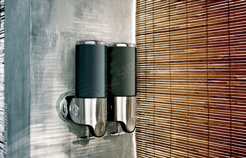 Blank black shampoo and lotion dispenser mockup, side view. Empty sprayer mock up isolated. Soap pulverizer for hands template