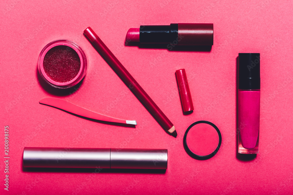 Beauty tools laying on a vivid pink background. Beauty tools laying on a vivid pink background.