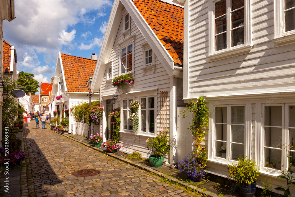 Street with white houses in the old part of Stavanger, Norway.
