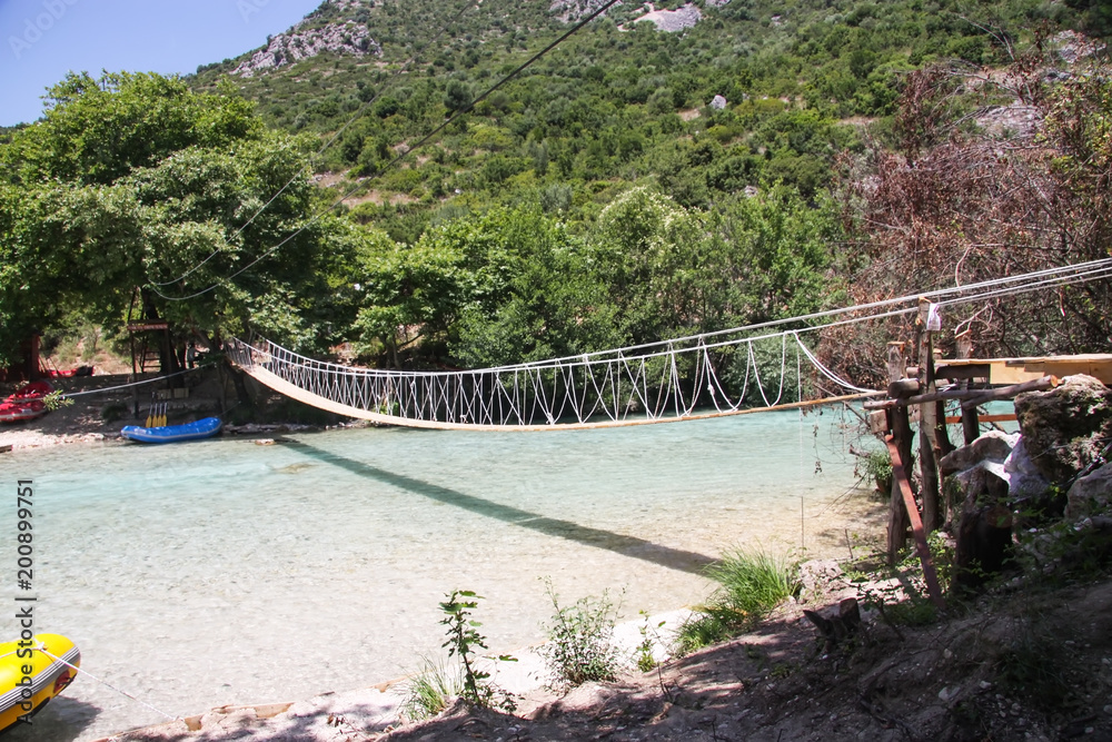 Suspension bridge over a mountain stream