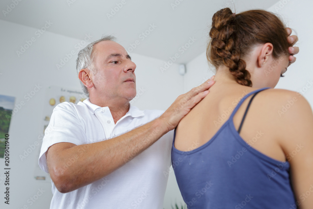 Obraz premium professional osteopathy therapy treatment on neck of female patient