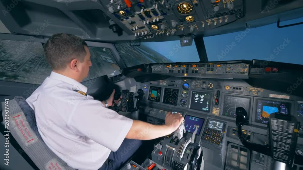An airman sits in a flight simulator and turns a plane to the left. 4K. An airman sits in a flight simulator and turns a plane to the left. 4K.