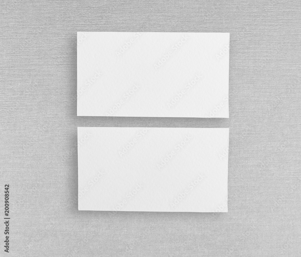 Mockup of two horizontal business cards at grey background. Mockup of two horizontal business cards at grey background.