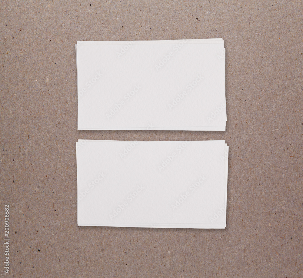 Mockup of two horizontal business cards at brown paper background. Mockup of two horizontal business cards at brown paper background.
