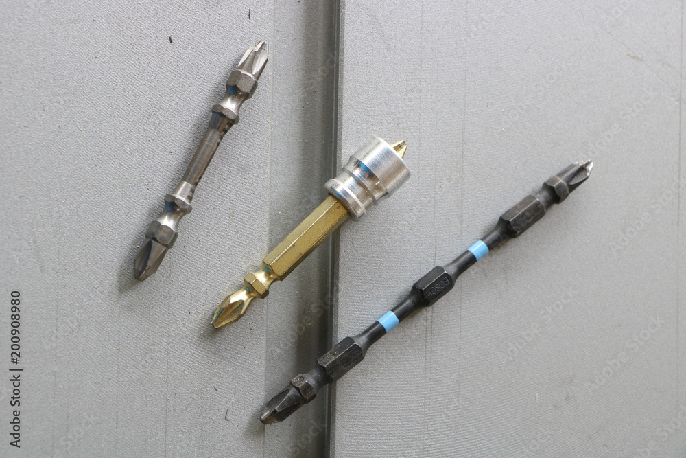 Fototapeta premium Driver bits, different bits for screwdriver, tools for household use for improving home or woodworking