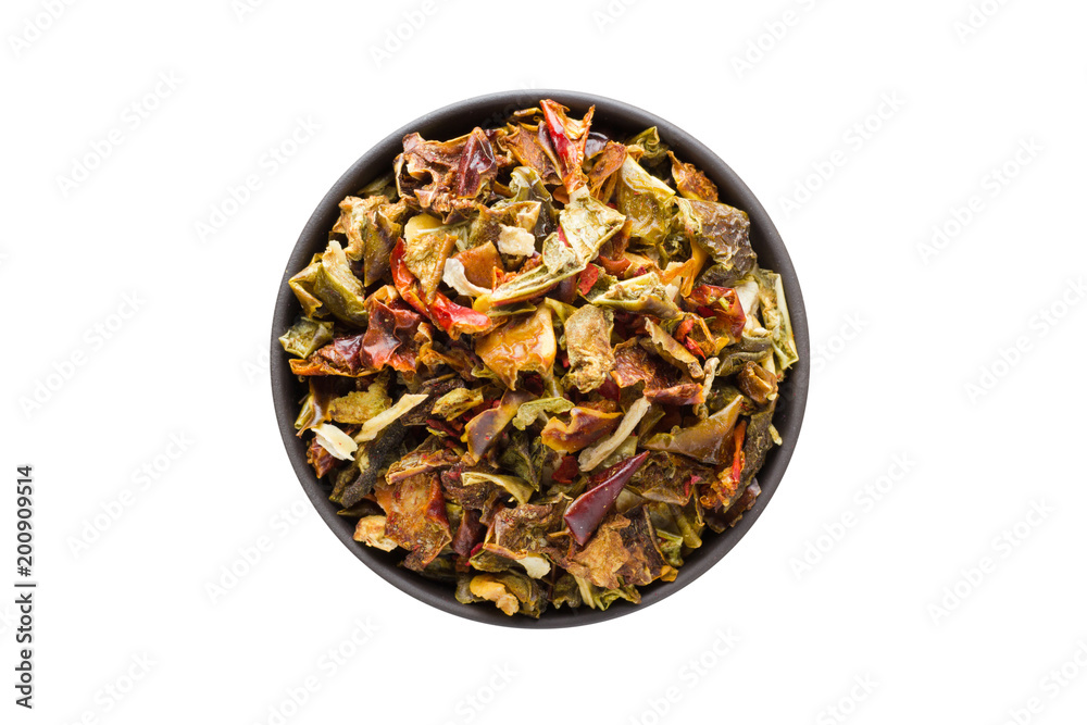 dried vegetables in clay bowl isolated on white background. Seasoning or spice top view dried vegetables in clay bowl isolated on white background. Seasoning or spice top view