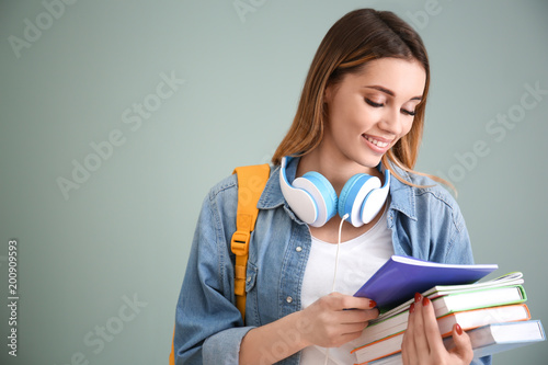 Pretty student with noteboo...