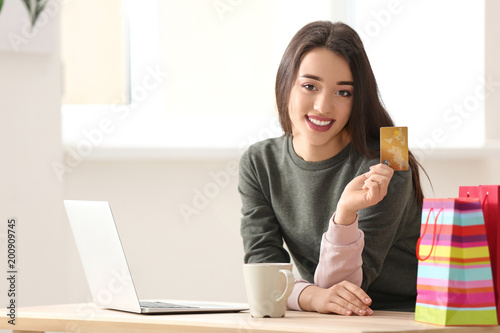 Young woman shopping online...