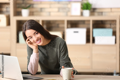 Young woman shopping online...