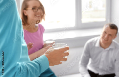 Office employees drinking w...