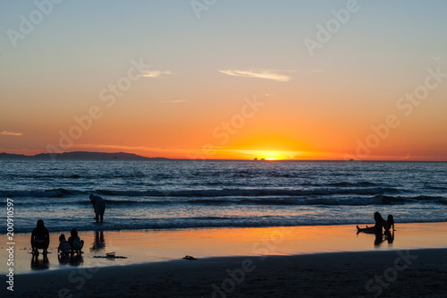golden beach sunset on Huntington beach in southern California © Gabriel Cassan