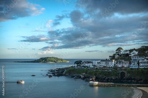 Fishing boat entering Looe harbour on the south coast of Cornwall
