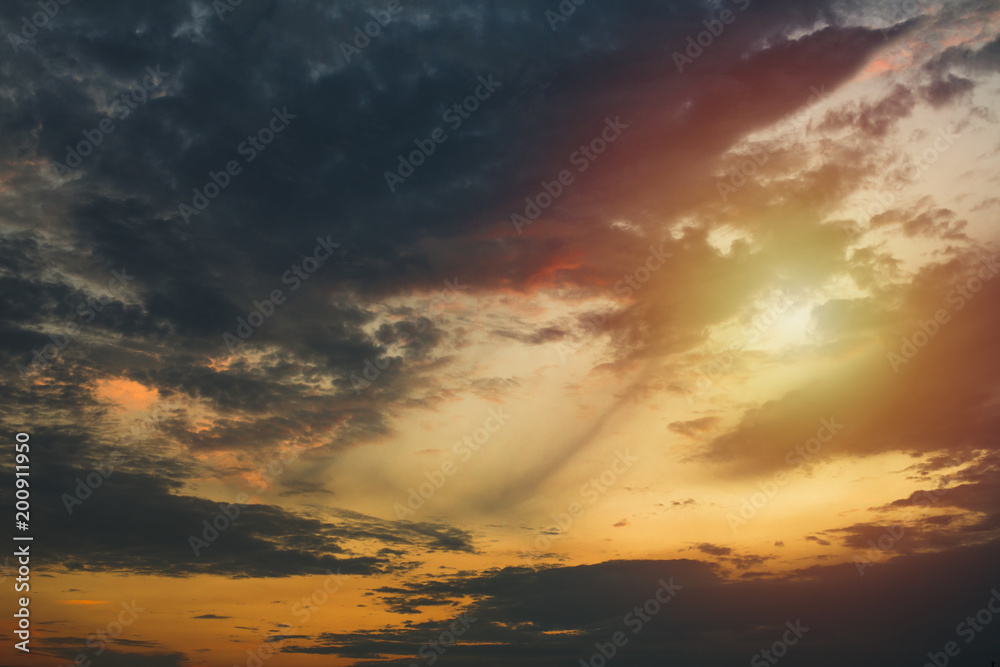 Abstract nature background. Dramatic and moody yellow, purple, blue and red cloudy sunset sky