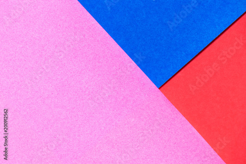 Pink, red and blue color paper display as abstract blank background