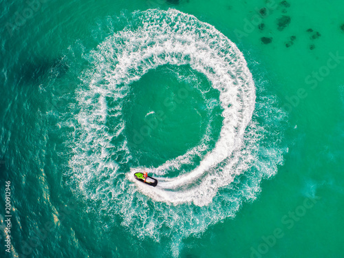 People are playing jet ski at sea during the holidays. Aerial view and top view. © MAGNIFIER