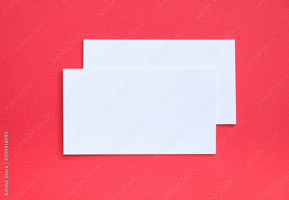 Two business cards on red background Two business cards on red background
