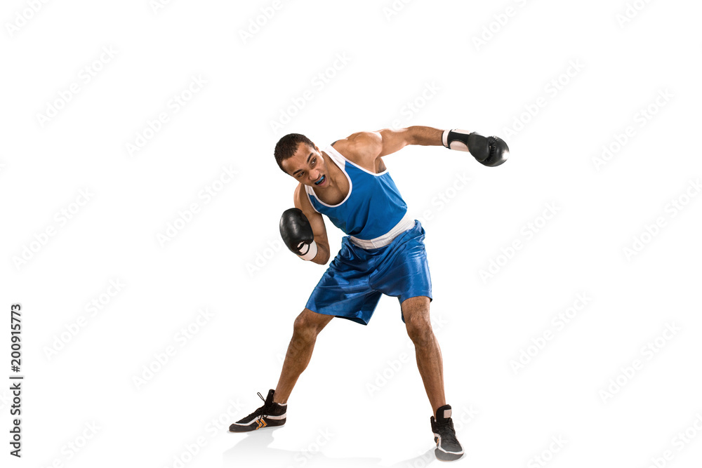 Sporty man during boxing exercise. Photo of boxer on white background