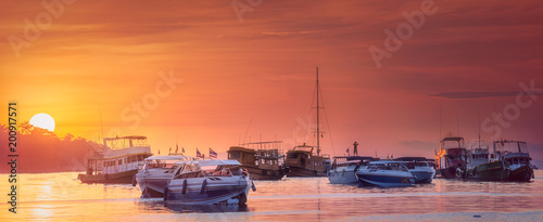 Seascape of sunset with boats on the sea