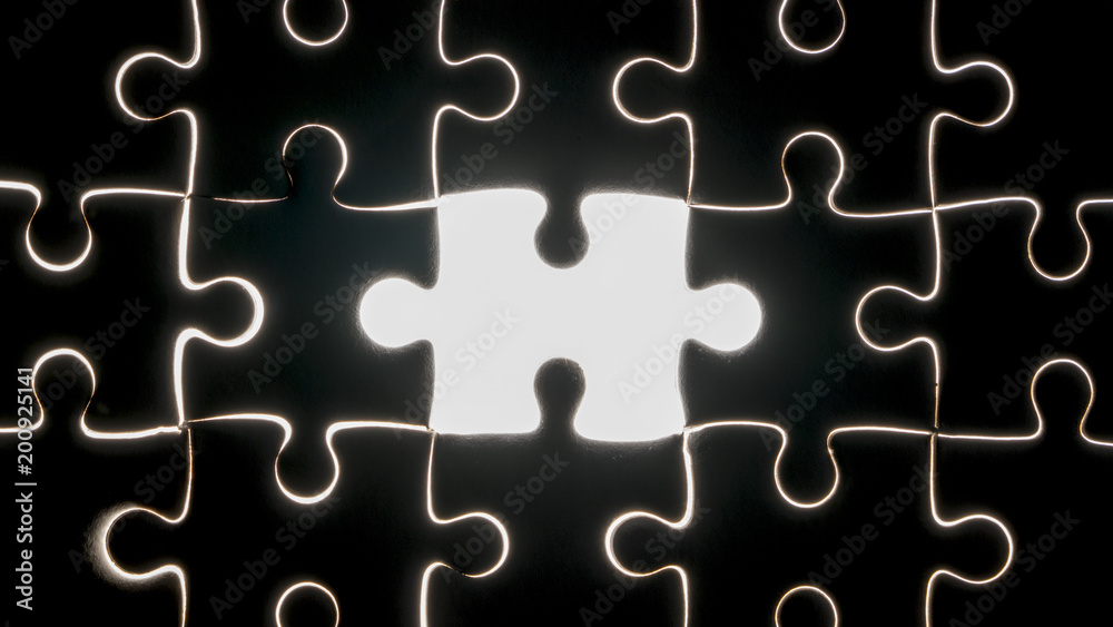 hand holding piece of white jig saw puzzle place to match or completing the final pazzle piece.Success,game,solve problem business concept. hand holding piece of white jig saw puzzle place to match or completing the final pazzle piece.Success,game,solve problem business concept.