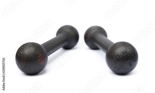 Old fitness dumbbells isolated on a white background