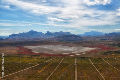 Crimea, view from Mount Klementyev to vineyards and salt lake Barakol photo