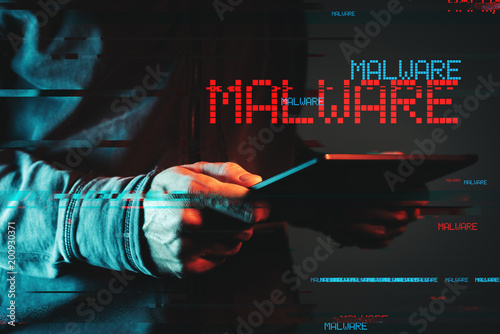 Malware concept with person using tablet computer