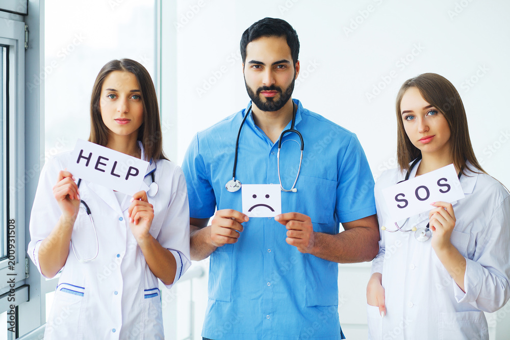 Fototapeta premium Doctor holding a card with Symbol Smile. Help and Sos, Medical concept