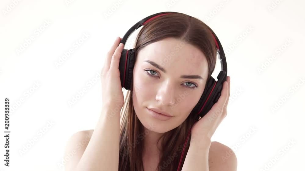 Portrait of a woman with big headphones with music