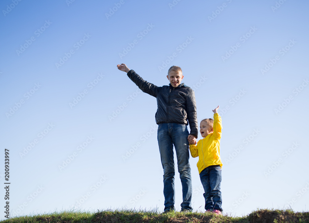 guy and a girl are standing on the grass guy and a girl are standing on the grass