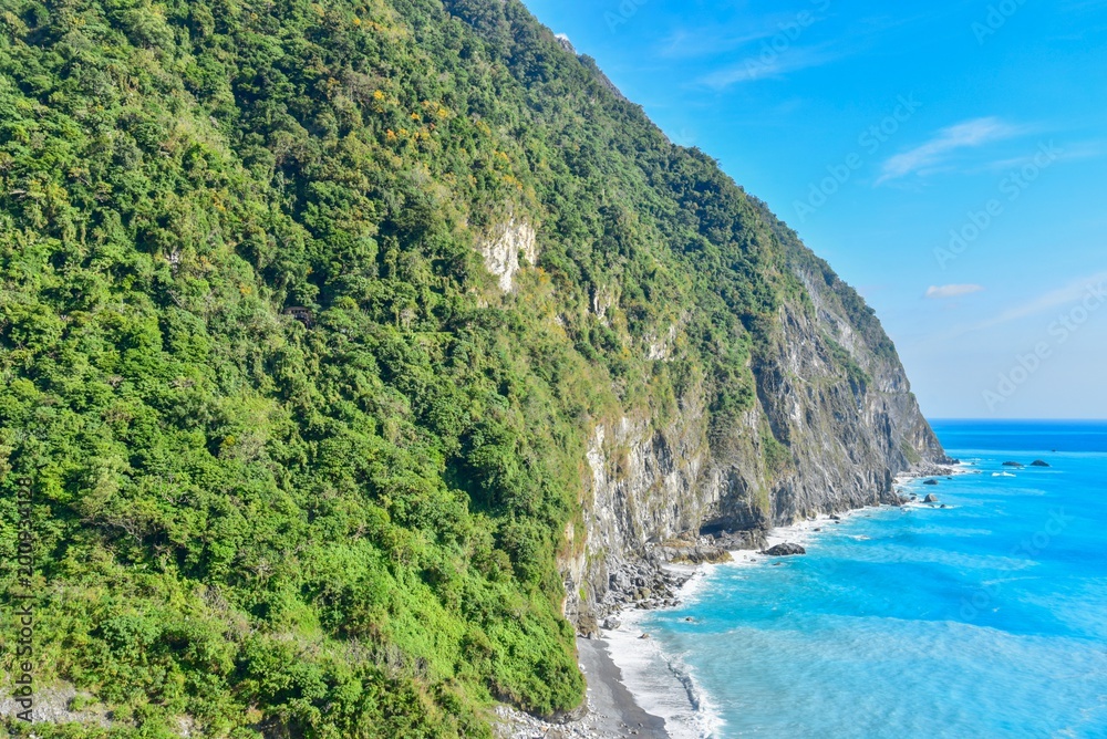 Clear Blue Water and Lush Green Mountains of Qingshui Cliff in Taiwan