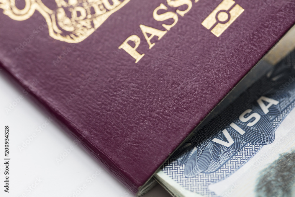 Close up of a Visa document and passport. Immigration and emigration concept
