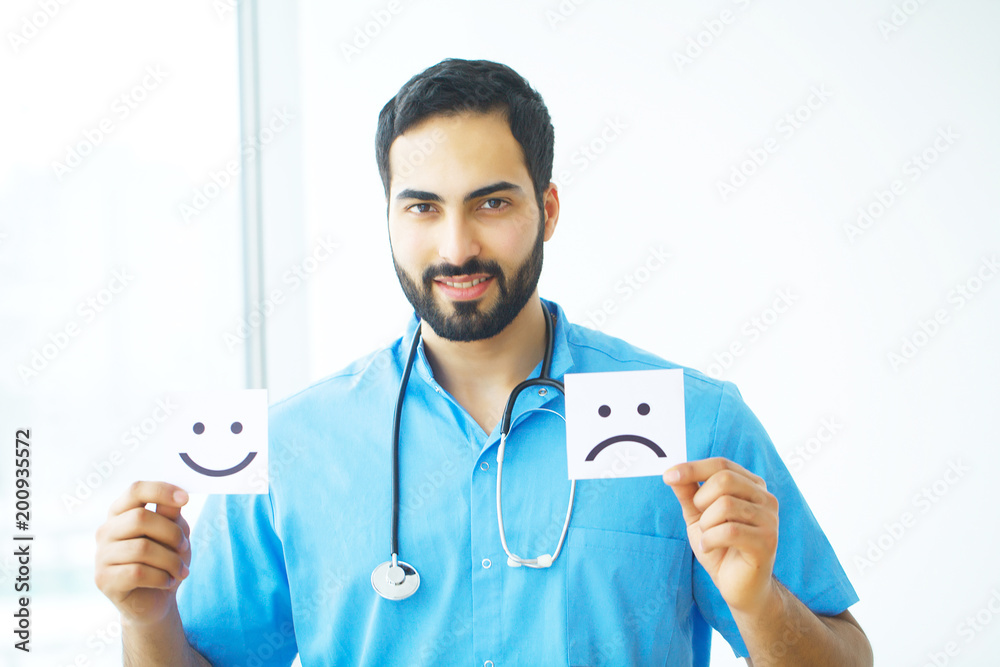 Doctor holding a card with symbol Smile, Medical concept Doctor holding a card with symbol Smile, Medical concept
