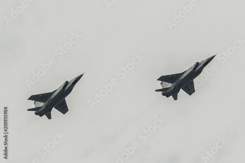 two airplanes mig 31 flying against the sky