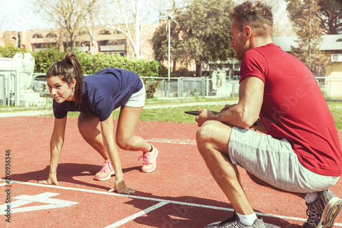 the coach times and gives tips for the ride to his athlete photo