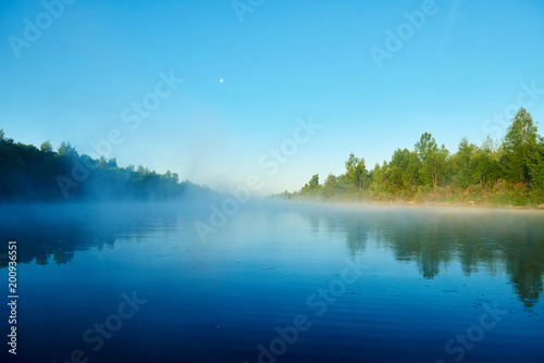 River and fog. Early morning with sunrise. Backlighting