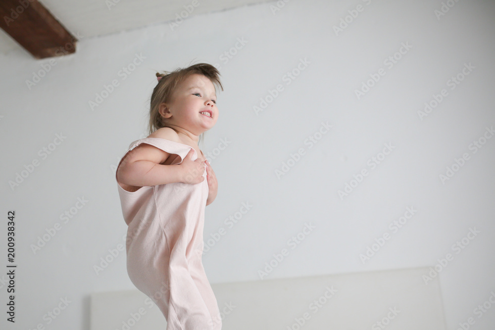 funny girl toddler lifestyle smile jumping on bed funny girl toddler lifestyle smile jumping on bed