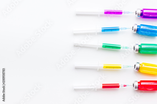 Syringe with colored drug. Injection concept on white background top view copy space pattern Free Download Syringe with colored drug. Injection concept on white background top view copy space pattern - GFXLoad