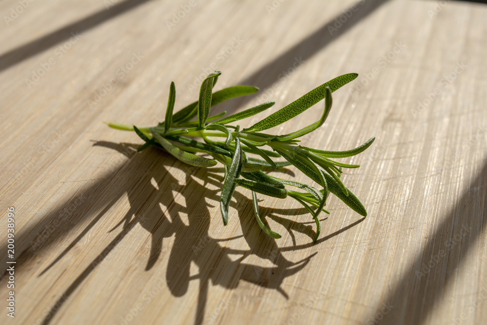 Rosemary herb Isolated on cutting board2 Rosemary herb Isolated on cutting board2