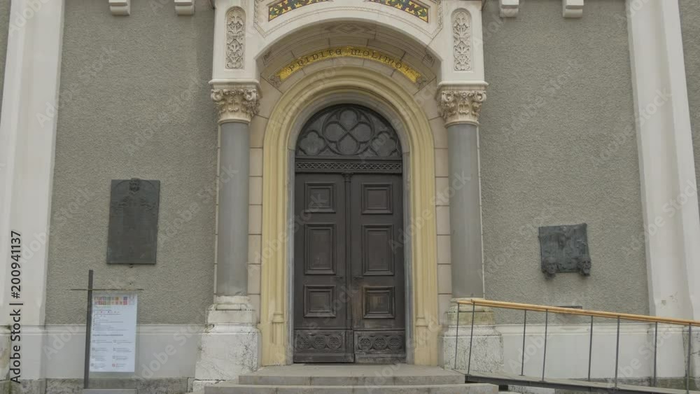 Tilt up of Trnovo Church's entrance in Ljubljana Tilt up of Trnovo Church's entrance in Ljubljana