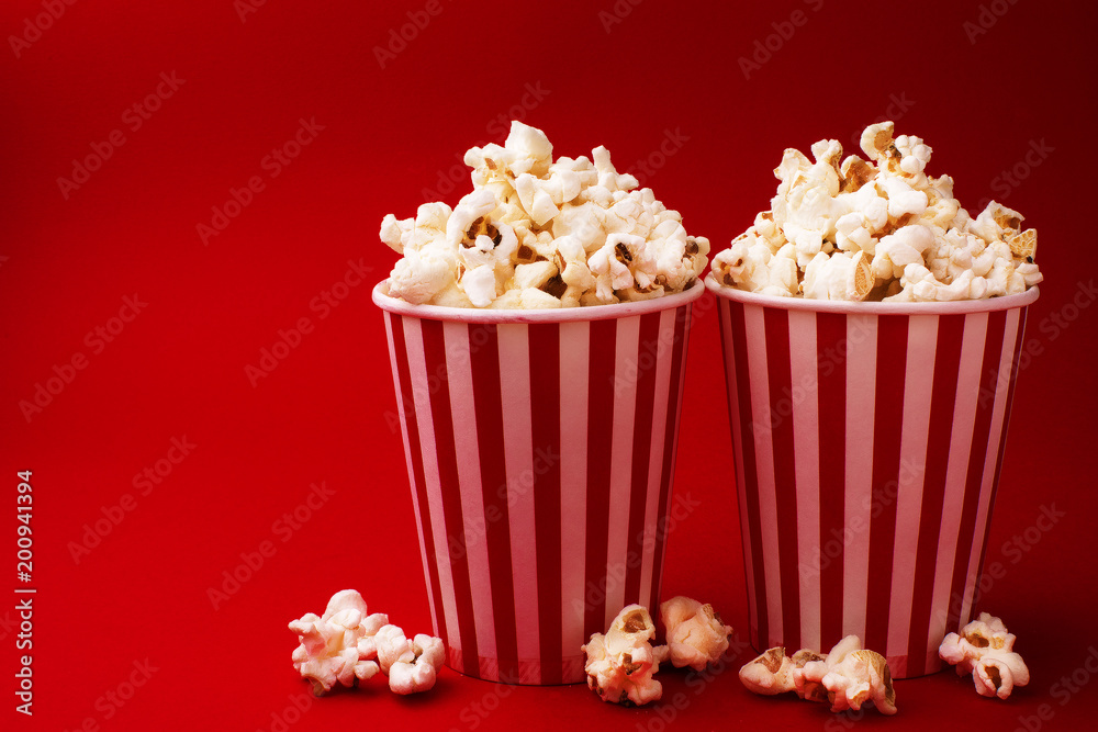 popcorn in two hollow boxes on a red background popcorn in two hollow boxes on a red background