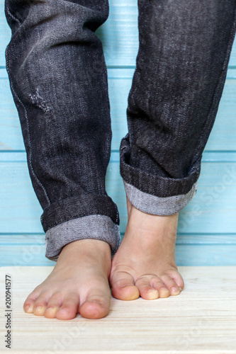The legs of a little girl - fashionistas in black jeans