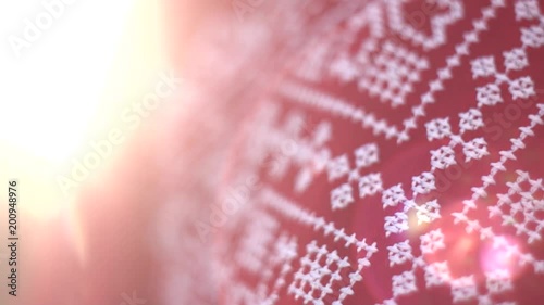 Red texture cloth embroidered with thick white thread in warm sunlight, close-up. Vyshyvanka, traditional folk ethnic ukrainian national costume. Eastern European hand embroidered shirt sorochka.