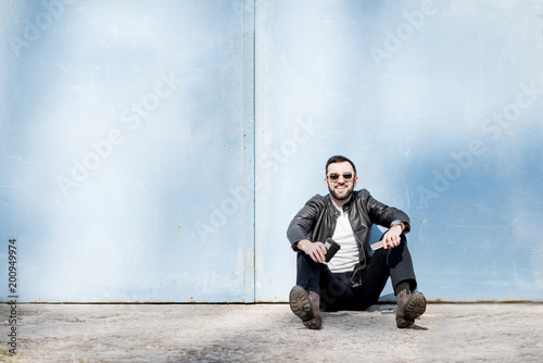 Man portrait on the blue wall background